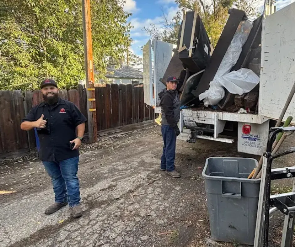 Our family-owned junk removal crew loading a truck in Modesto, CA